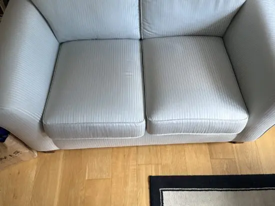 Light blue and white striped sofa