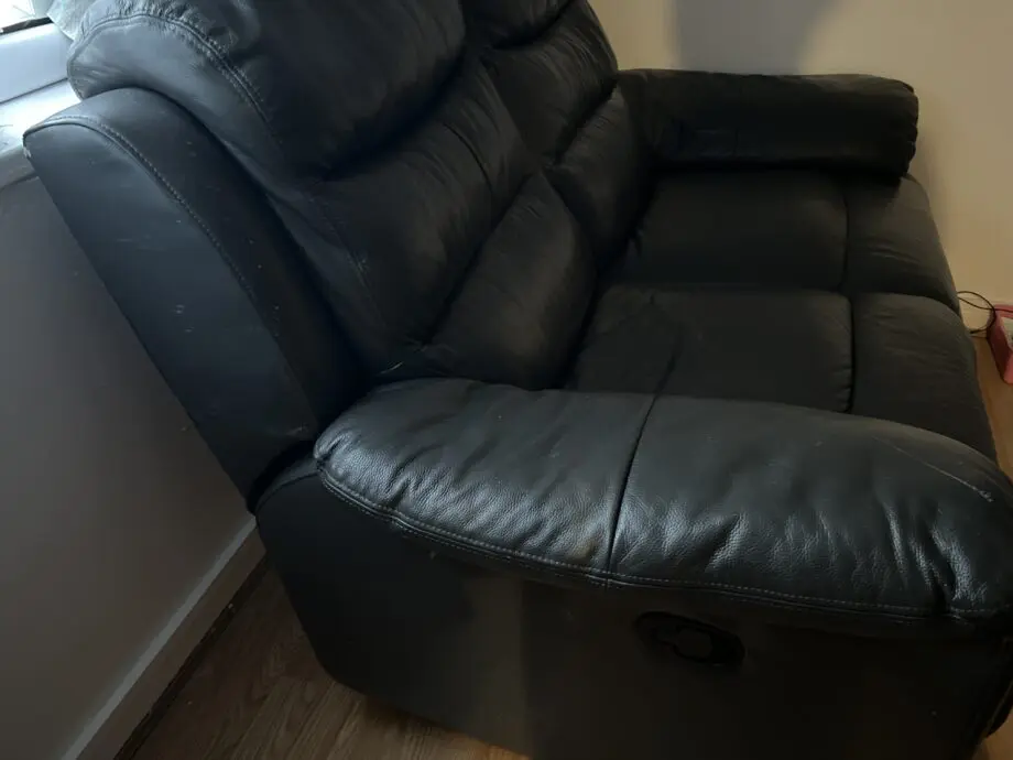 DFS black two seat expandable sofa