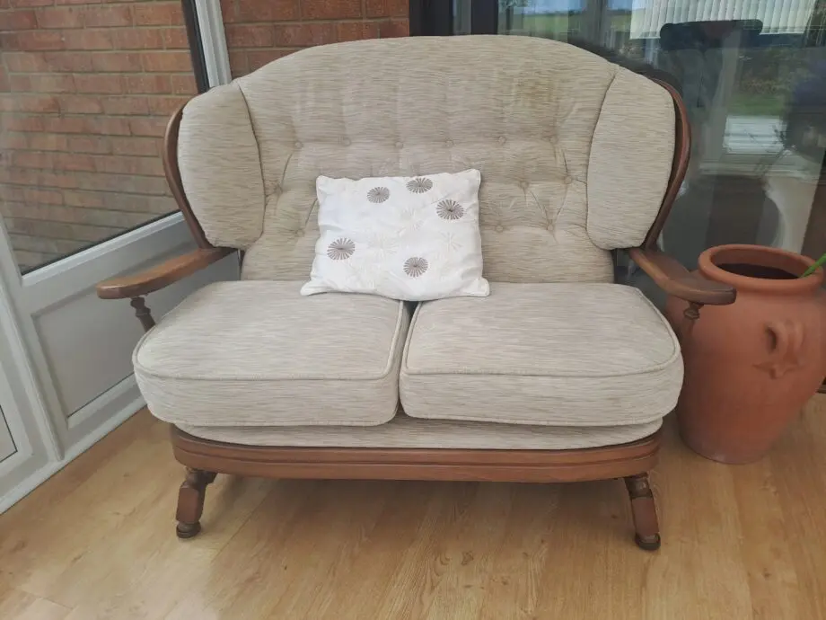Wooden framed two Seater sofa and two arm chairs.