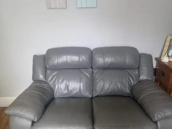 DFS 2 seater leather, recliner sofa and footstall