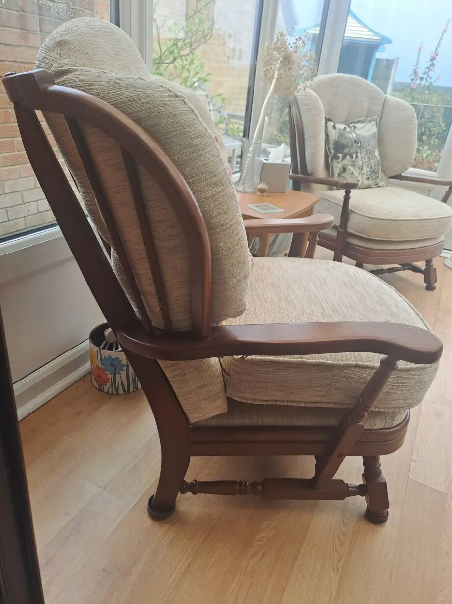 Wooden framed two Seater sofa and two arm chairs.