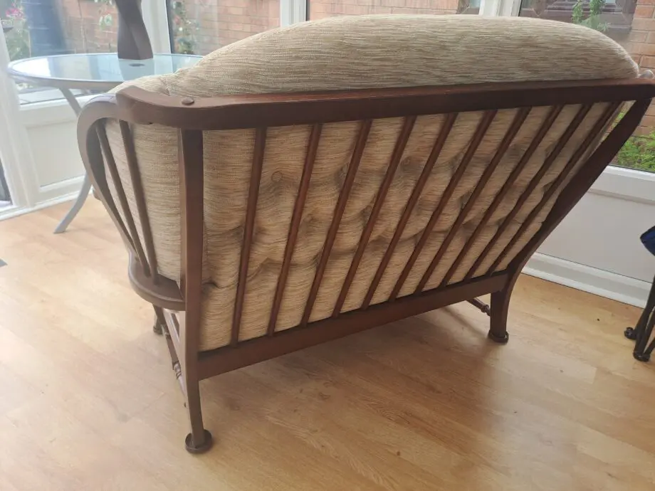 Wooden framed two Seater sofa and two arm chairs.