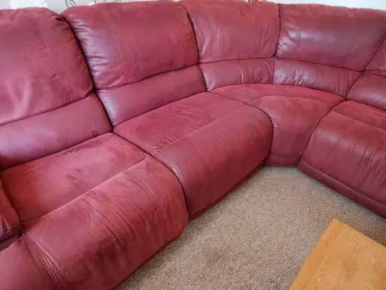 Large soft red leather corner sofa. Seats 5.