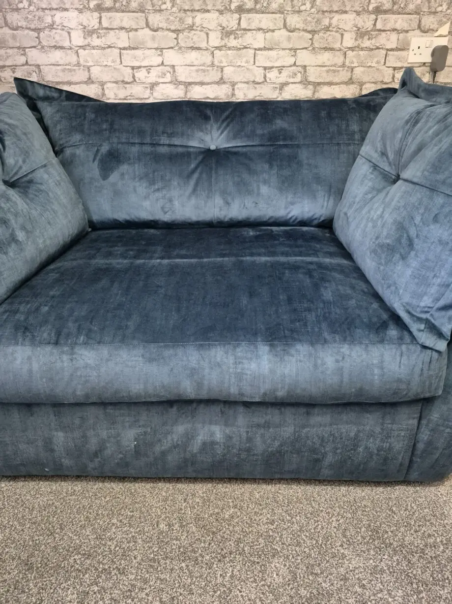 Dark blue velour snuggle sofa.
