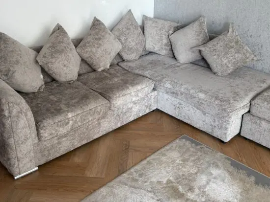 Grey corner sofa with footstool