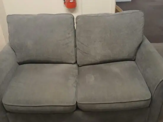 Nice firm Grey 2 seater sofa with cushions