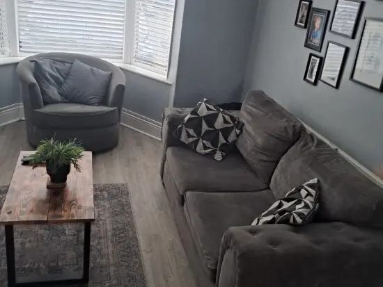 Grey 2 seater cuddle chair and puffy