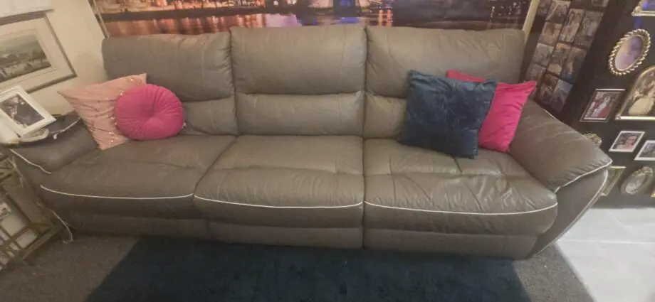 Dfs 4 seater sofa with with piping with recliners at each end
