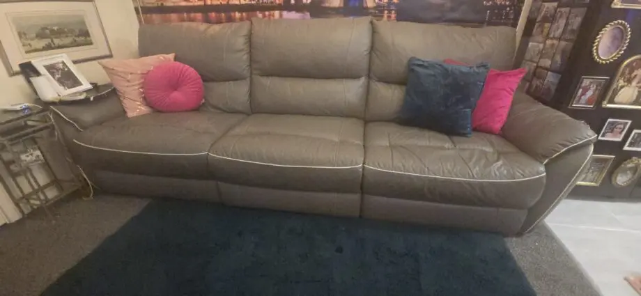 Dfs 4 seater sofa with with piping with recliners at each end