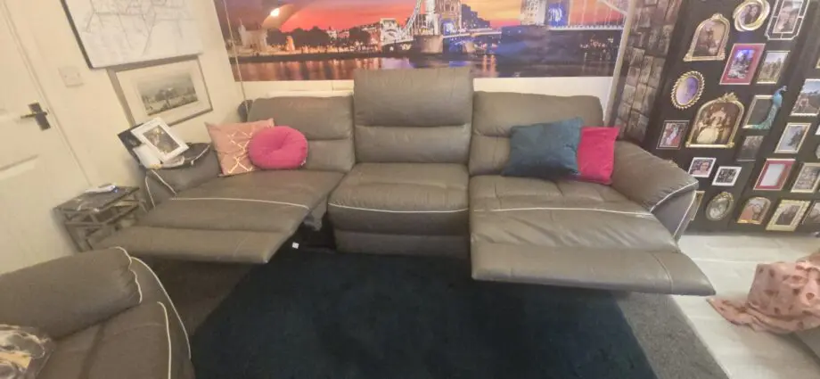 Dfs 4 seater sofa with with piping with recliners at each end