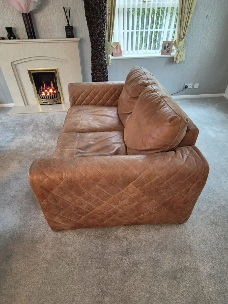 2 brown leather two-seater sofas