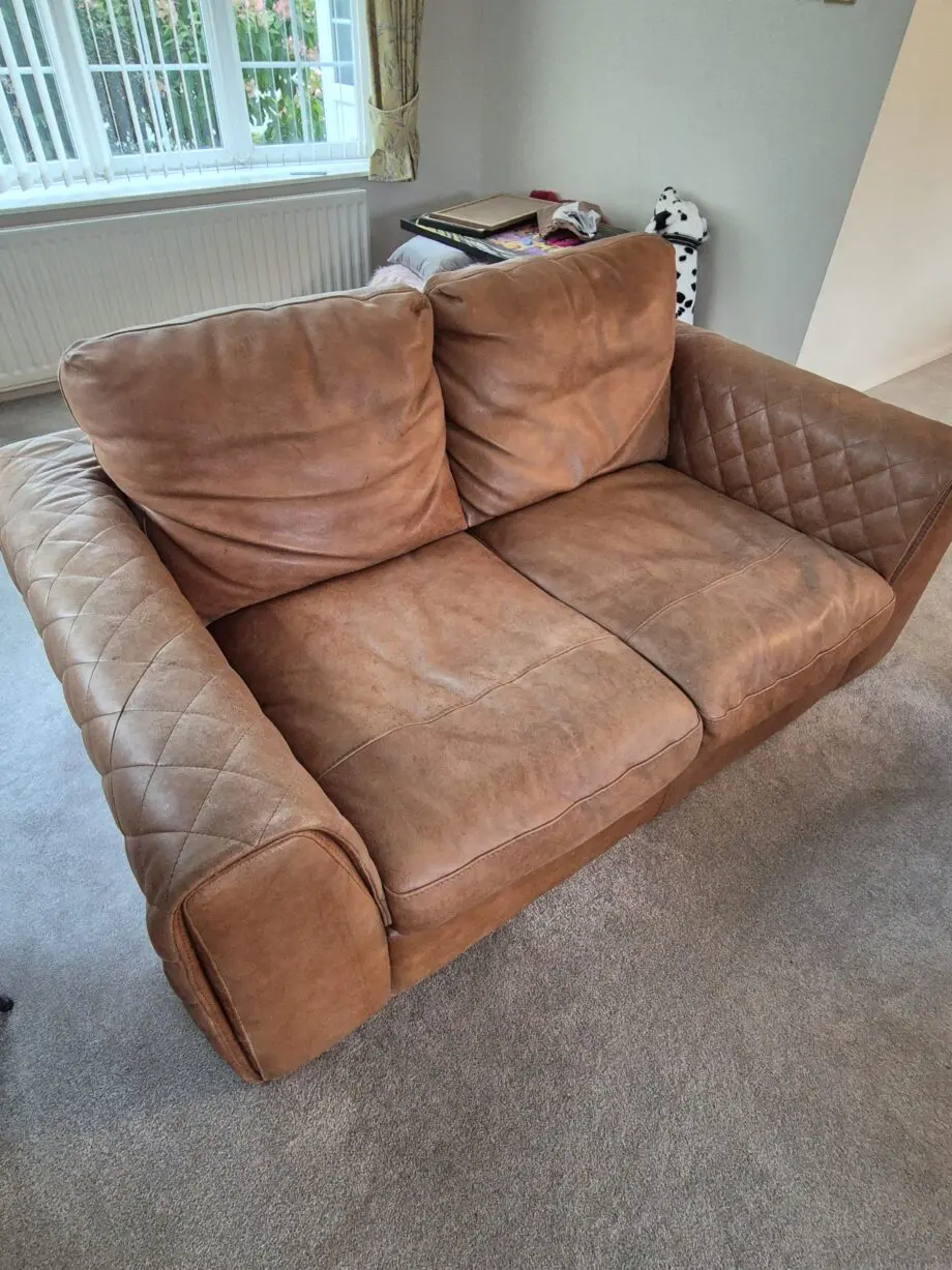 2 brown leather two-seater sofas