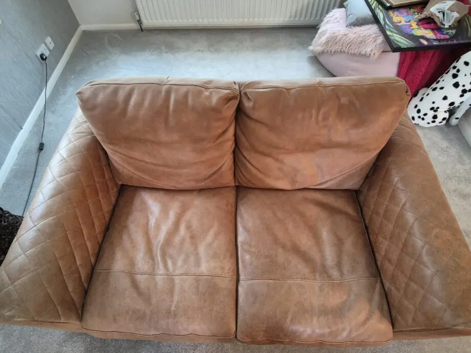 2 brown leather two-seater sofas
