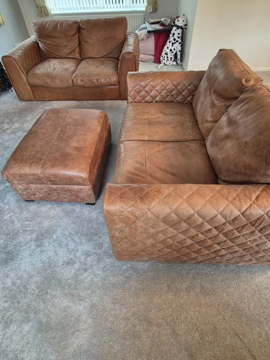 2 brown leather two-seater sofas