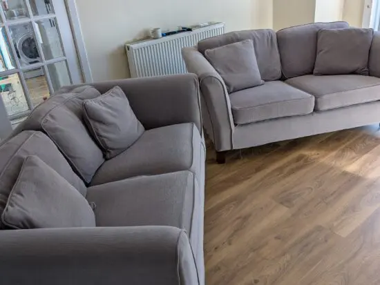 2 x 3 seater sofas with Grey custom covers