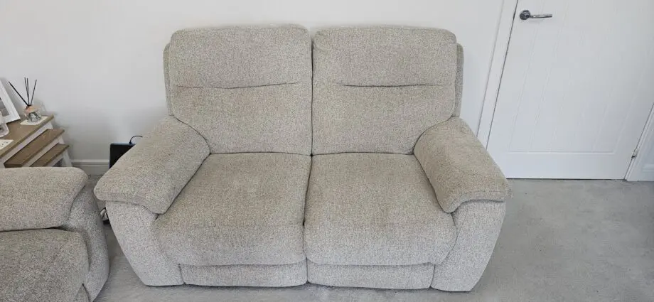 DFS 3 and 2 seater beige manual recliner sofa with ottoman Puffe
