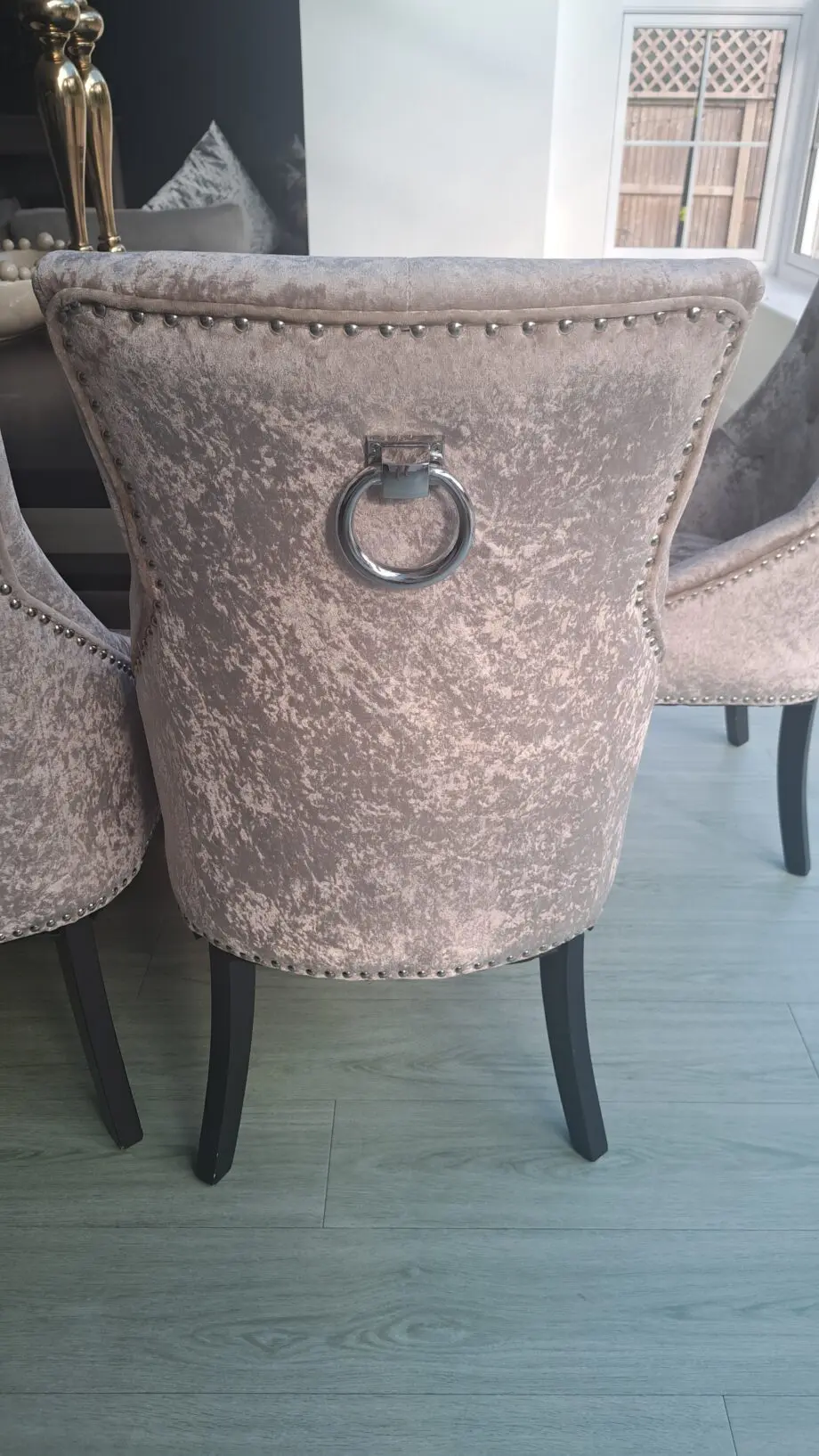 Grey/beige crushed velvet dining room chairs.