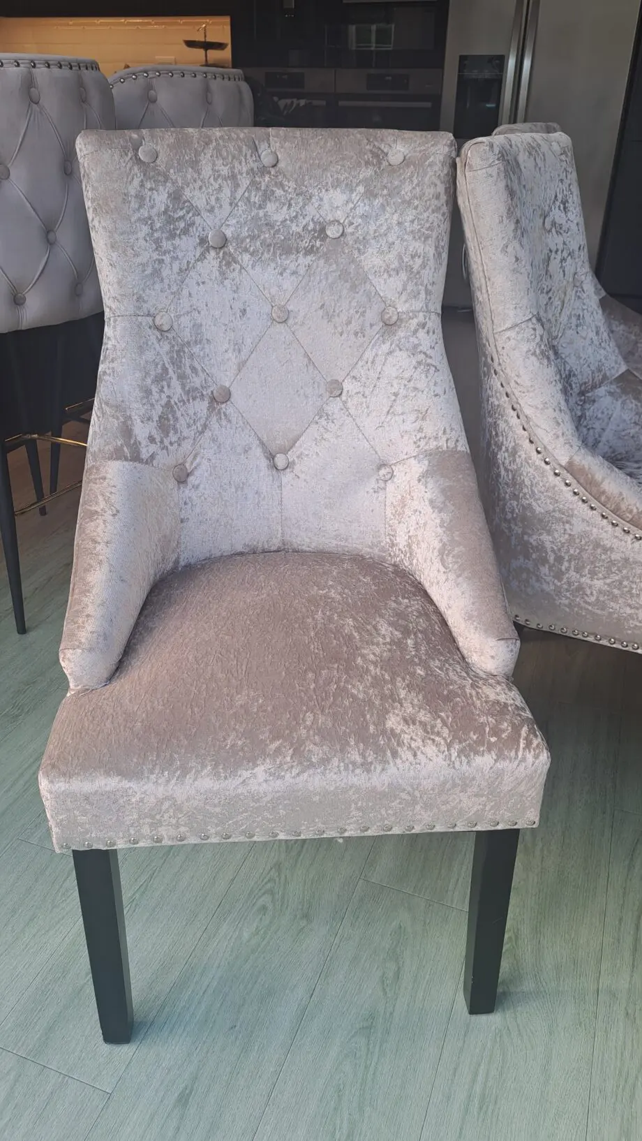 Grey/beige crushed velvet dining room chairs.