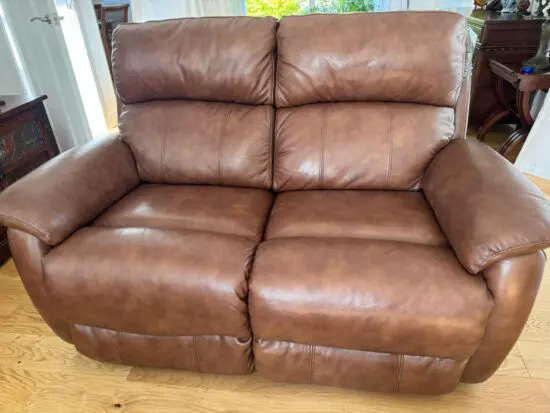 DFS Brown 2 seater recliner leather sofa in excellent condition