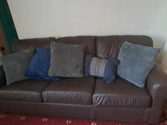 Brown leather three seater sofa