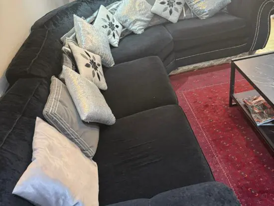Black velvet corner sofa