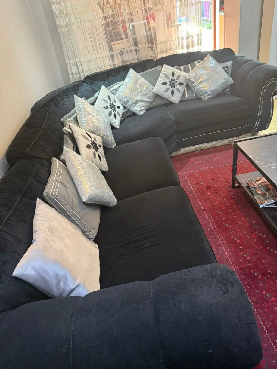 Black velvet corner sofa