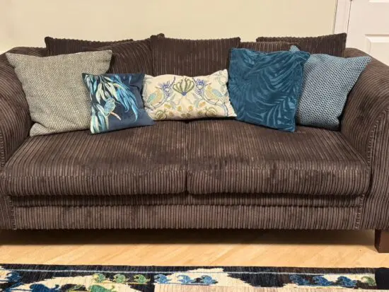 2 Soft Corduroy Upholstered 3 seater sofas with foam seating cushions and 5, 20” shatter cushions on each sofa