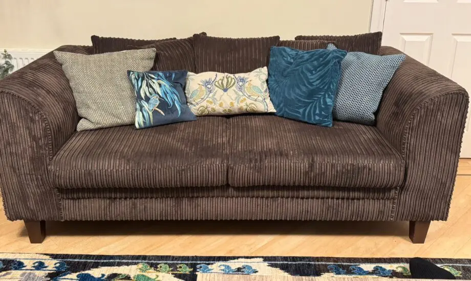 2 Soft Corduroy Upholstered 3 seater sofas with foam seating cushions and 5, 20” shatter cushions on each sofa