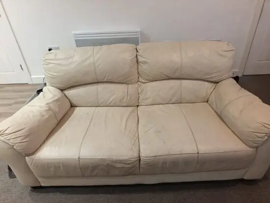 Two seater cream sofa