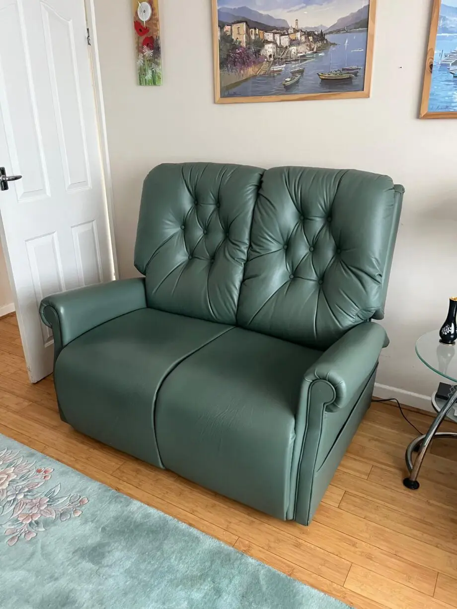 Green Leather 2 seater sofa and 2 recliner chairs