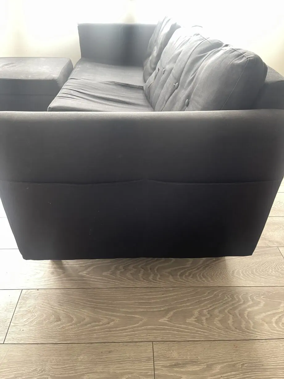 Black modern 3 seater sofa with leg stool