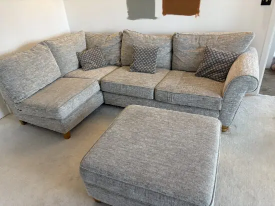 Corner L shaped sofa, good condition, matching footstool 90x90cm included