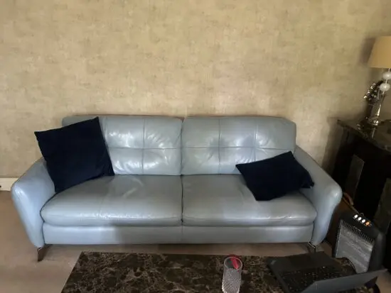 Sky blue leather sofa and footstool