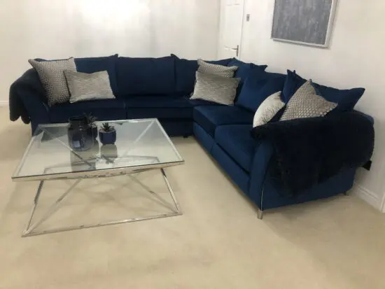 Blue velour 3 seater corner sofa with matching footstool