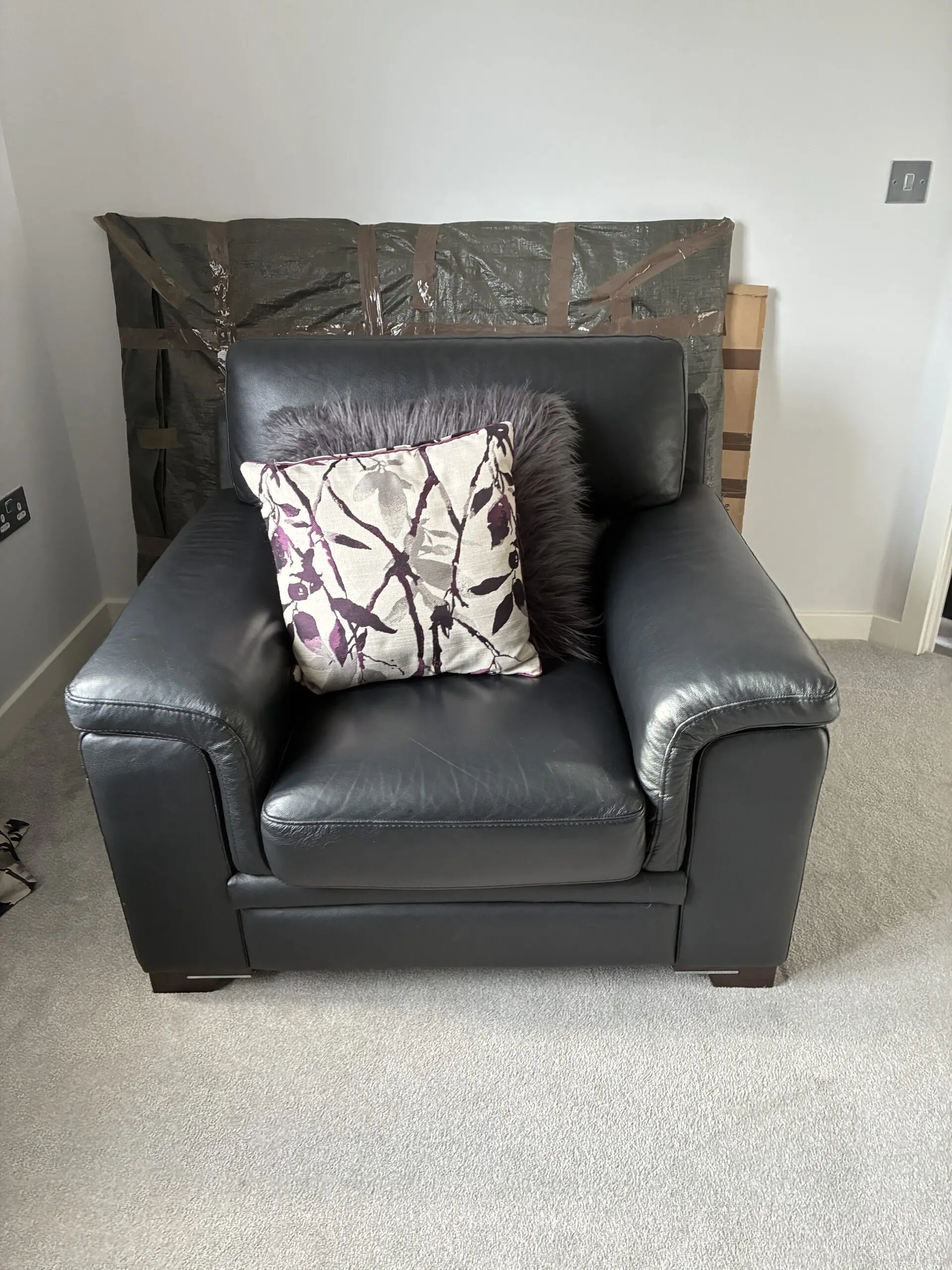 Harvey’s Black Leather Arm Chairs (x2) and Matching Foot Stool - Excellent Condition
