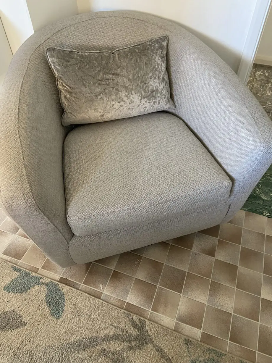 Grey fabric sofa, swivel chair and footstoll