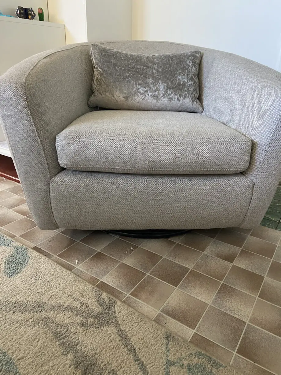 Grey fabric sofa, swivel chair and footstoll
