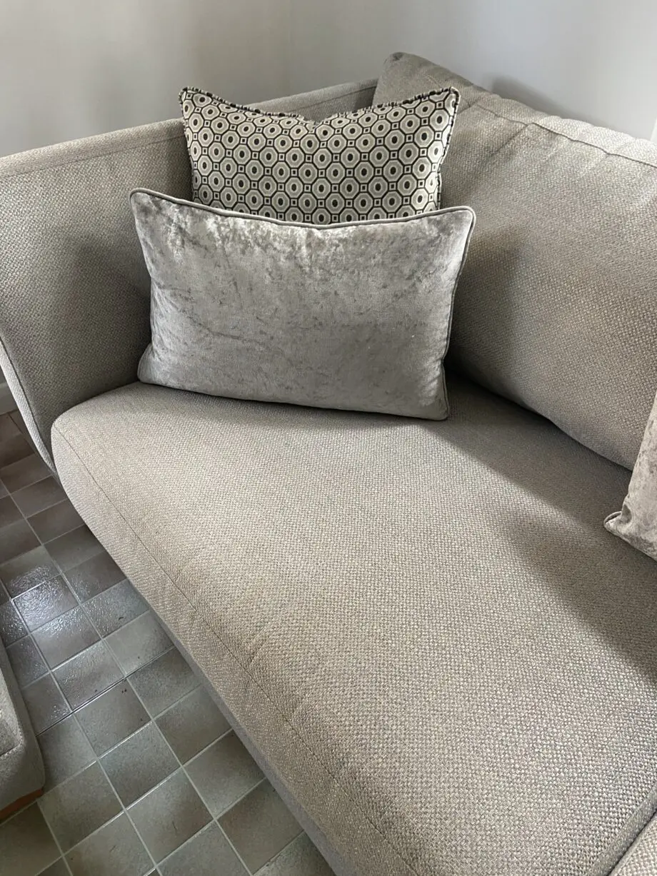 Grey fabric sofa, swivel chair and footstoll