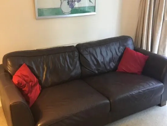 DFS dark brown leather sofa
