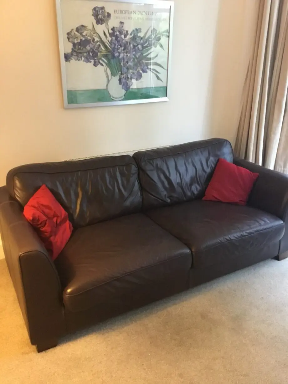 DFS dark brown leather sofa