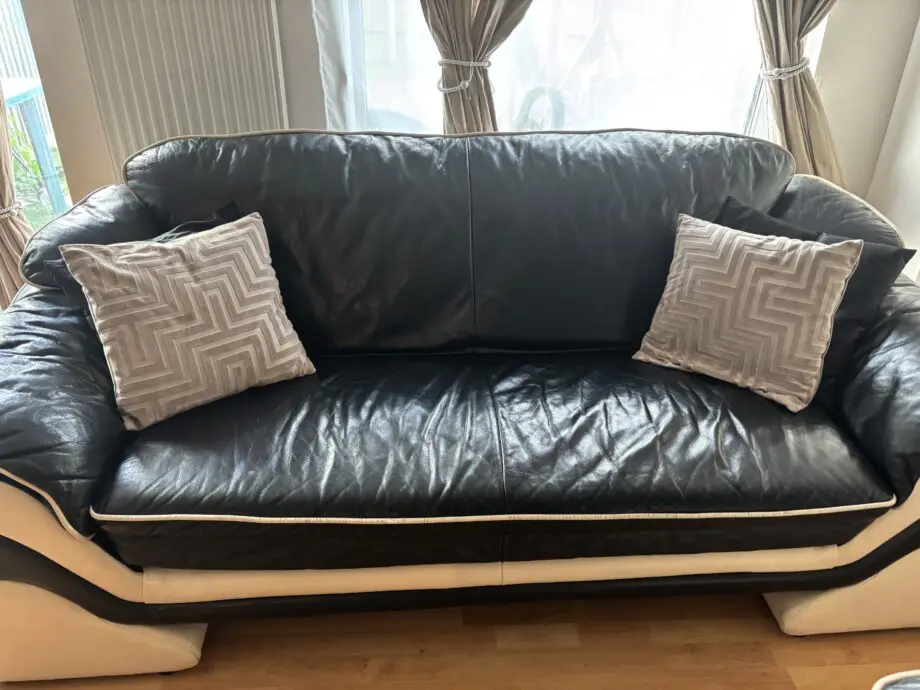 Good conditioned natucci Italian leather sofas black with cream