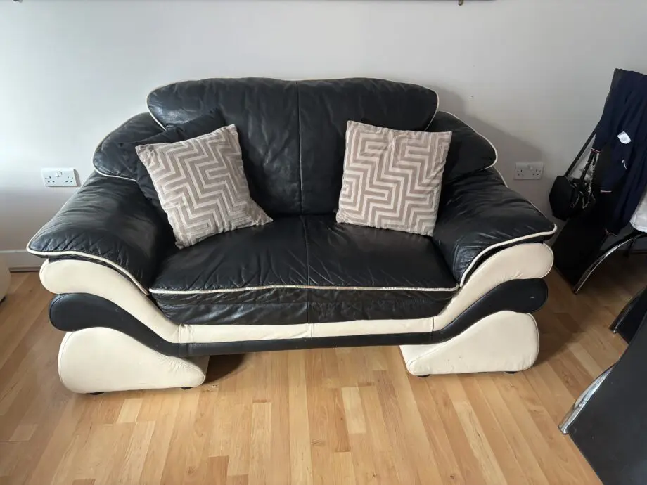 Good conditioned natucci Italian leather sofas black with cream