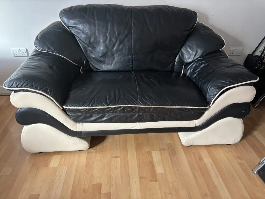 Good conditioned natucci Italian leather sofas black with cream