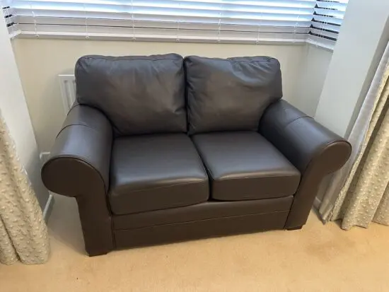 Brown leather two seater sofa