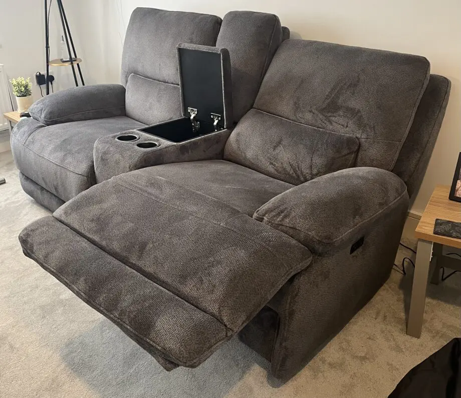 DFS brand new grey 2 seater recliner sofa with console and charging points