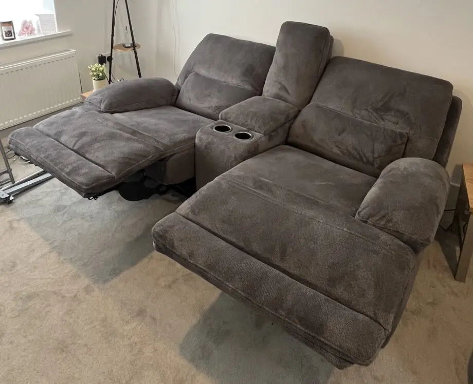 DFS brand new grey 2 seater recliner sofa with console and charging points