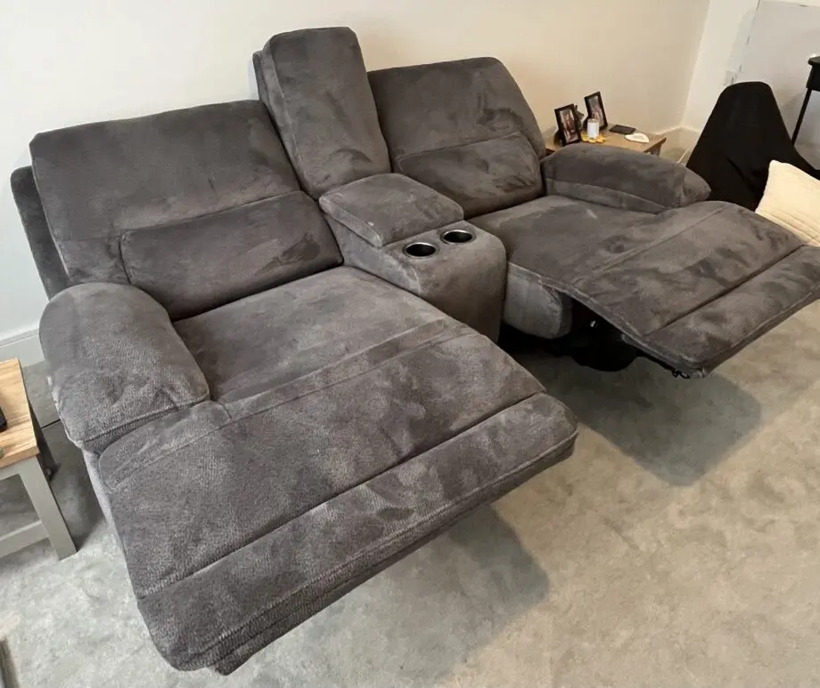 DFS brand new grey 2 seater recliner sofa with console and charging points