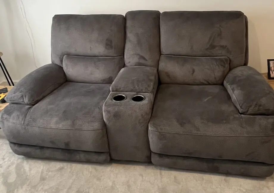 DFS brand new grey 2 seater recliner sofa with console and charging points