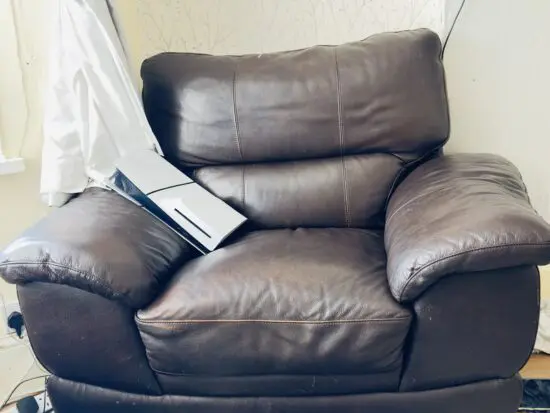 brown leather chair with footstool