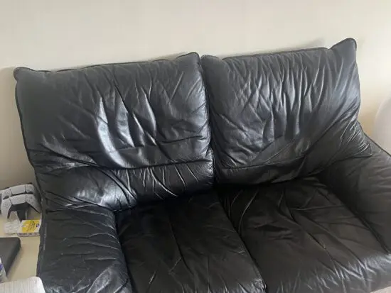 Black leather 2 seater sofa
